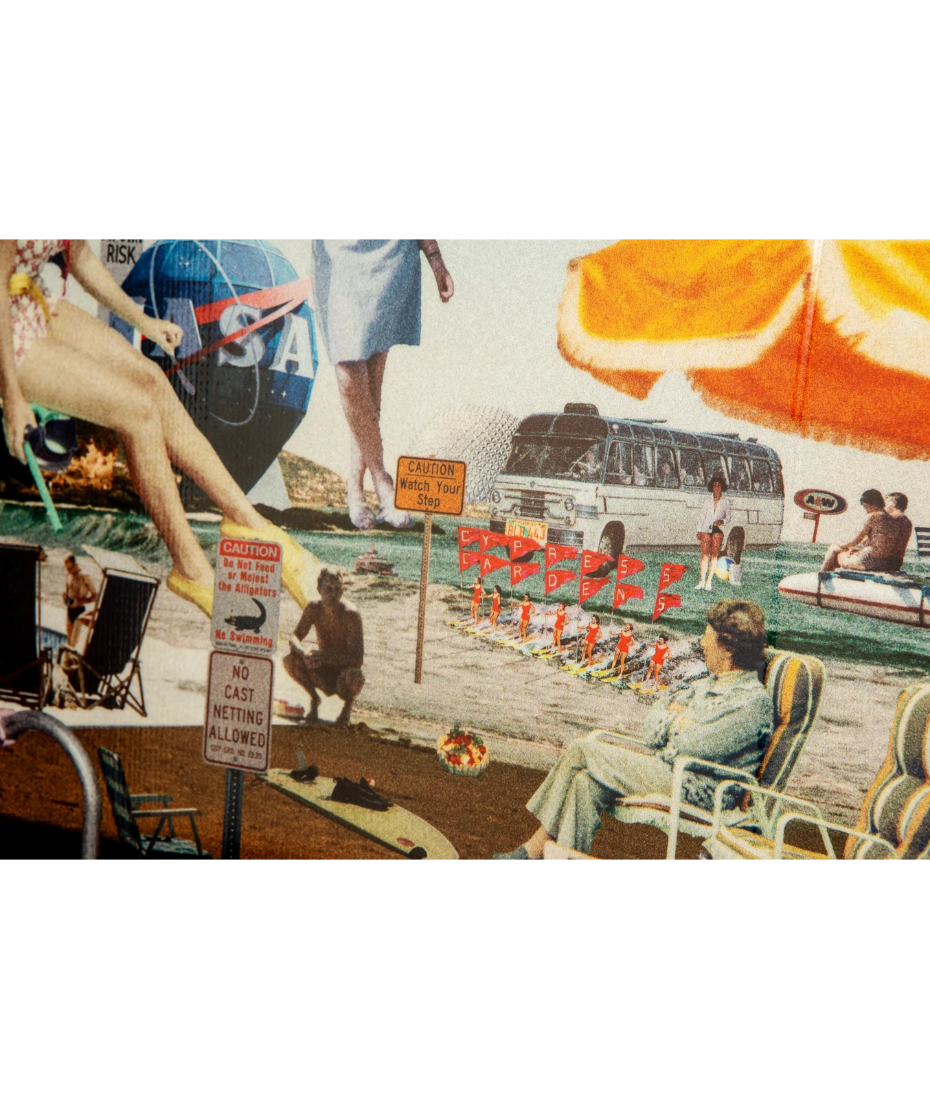 Ronix Supreme wakeboard graphic, showing the Nasa world statue, an umbrella, a woman sitting in a lawn chair, a gator crossing sign, a fruit bowl, Cypress gardens skiers