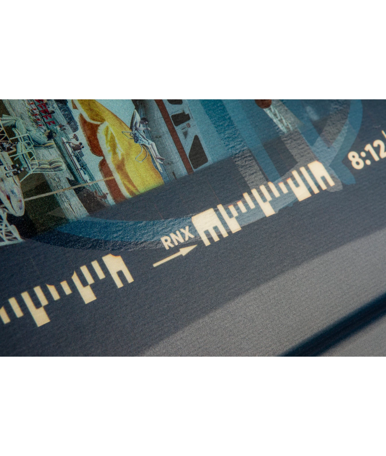 Ronix Supreme wakeboard graphic, showing the top middle graphic that features film markings with RNX and 8:12