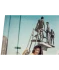 Ronix Supreme wakeboard graphic, showing the boys on a diving board, a woman with a scuba tank on, and a street sign