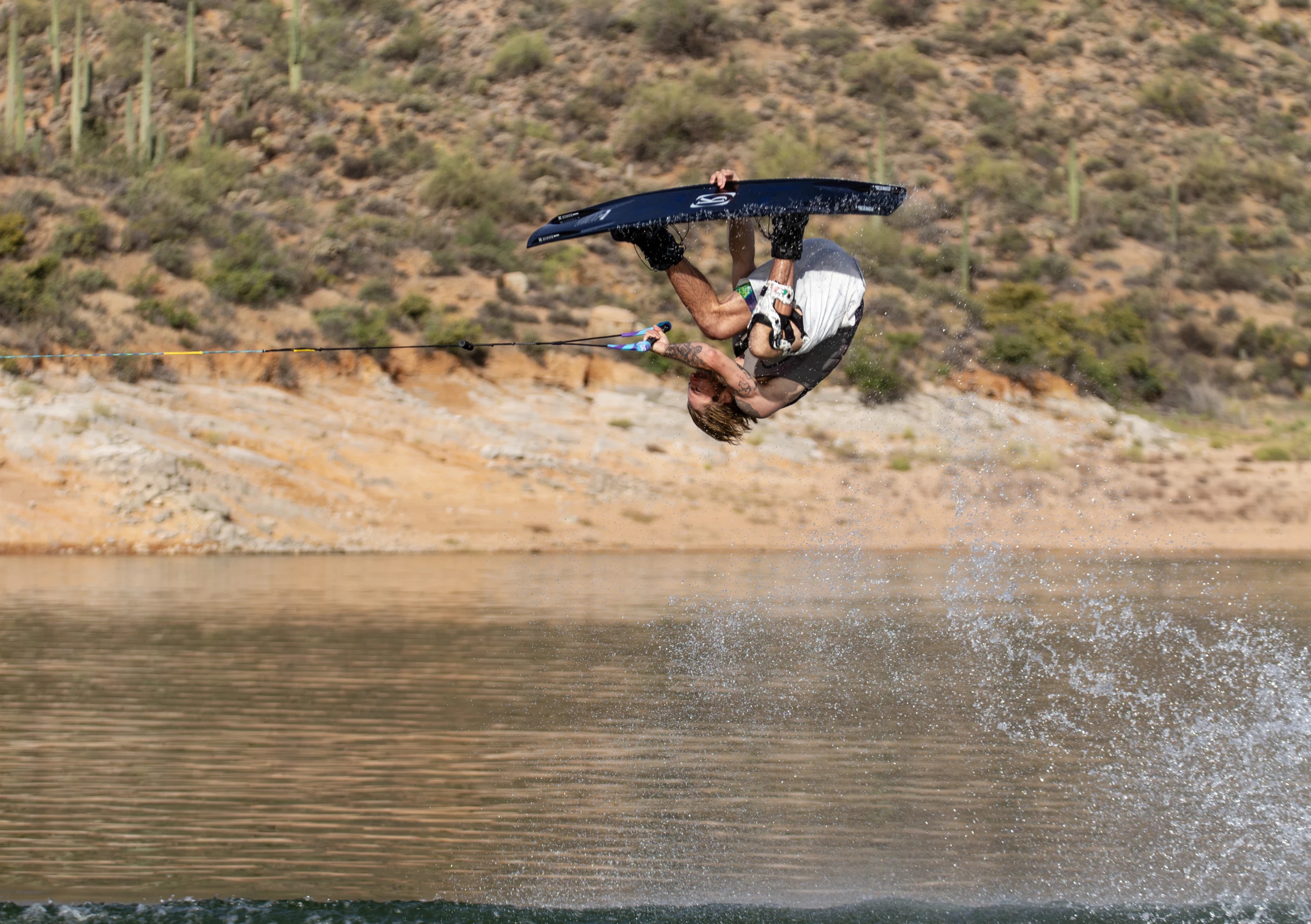 Action shot of Massi Piffaretti riding the Ronix RXT - Ronix Xperiemental Technology, with water in the background