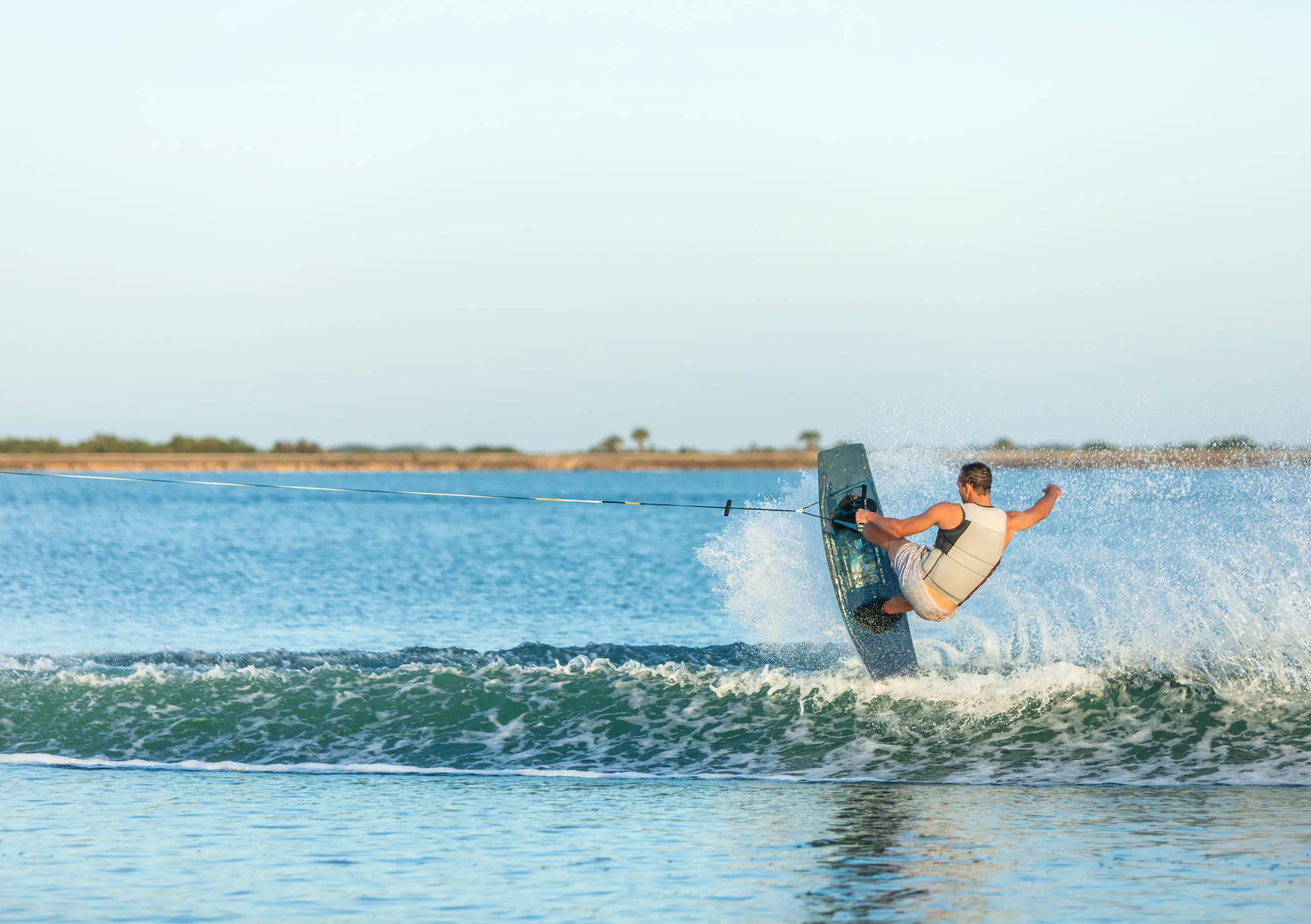 Action shot of Jake Pelot riding the Ronix Supreme wakeboard