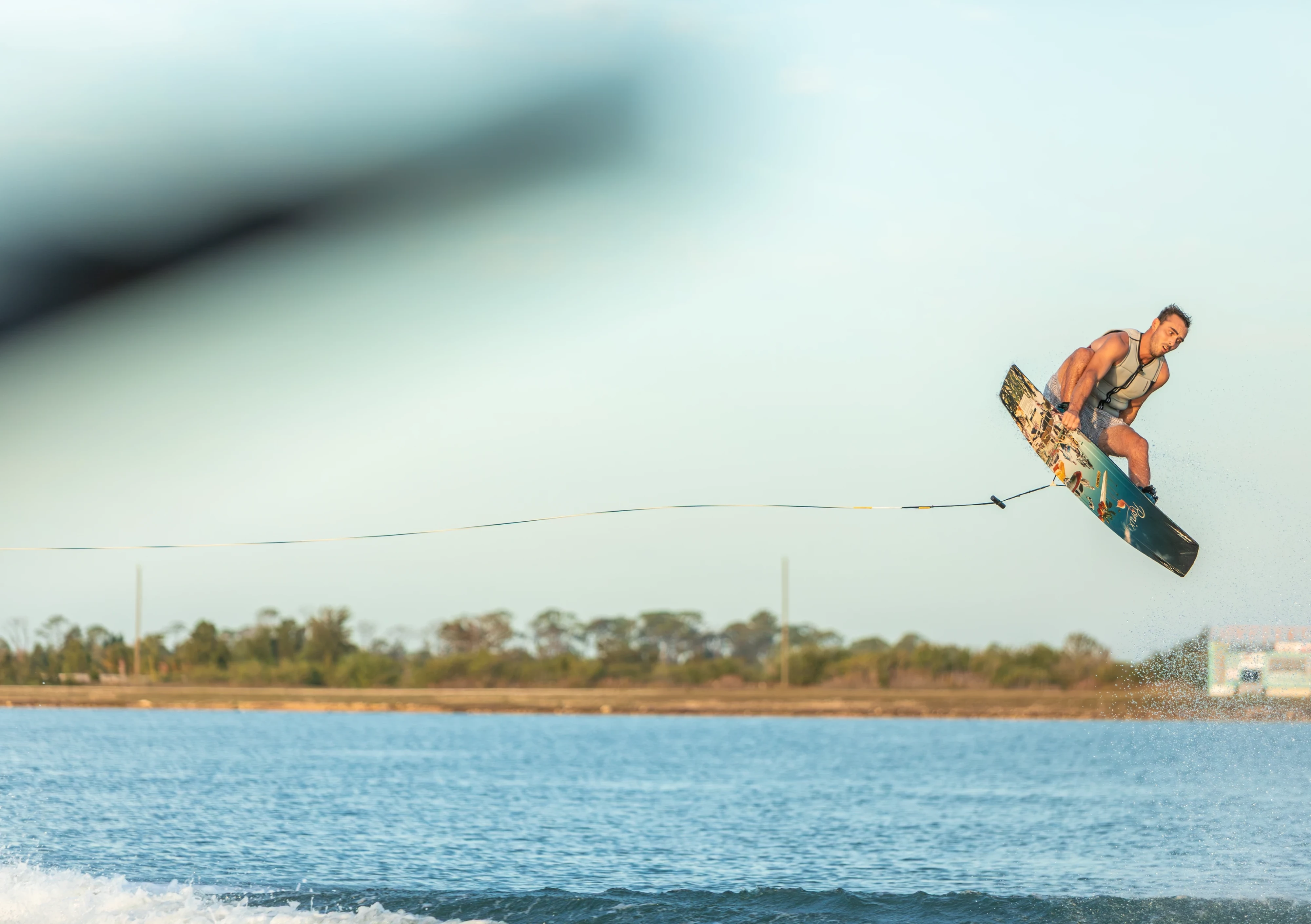 Action shot of Jake Pelot riding the Ronix Supreme wakeboard