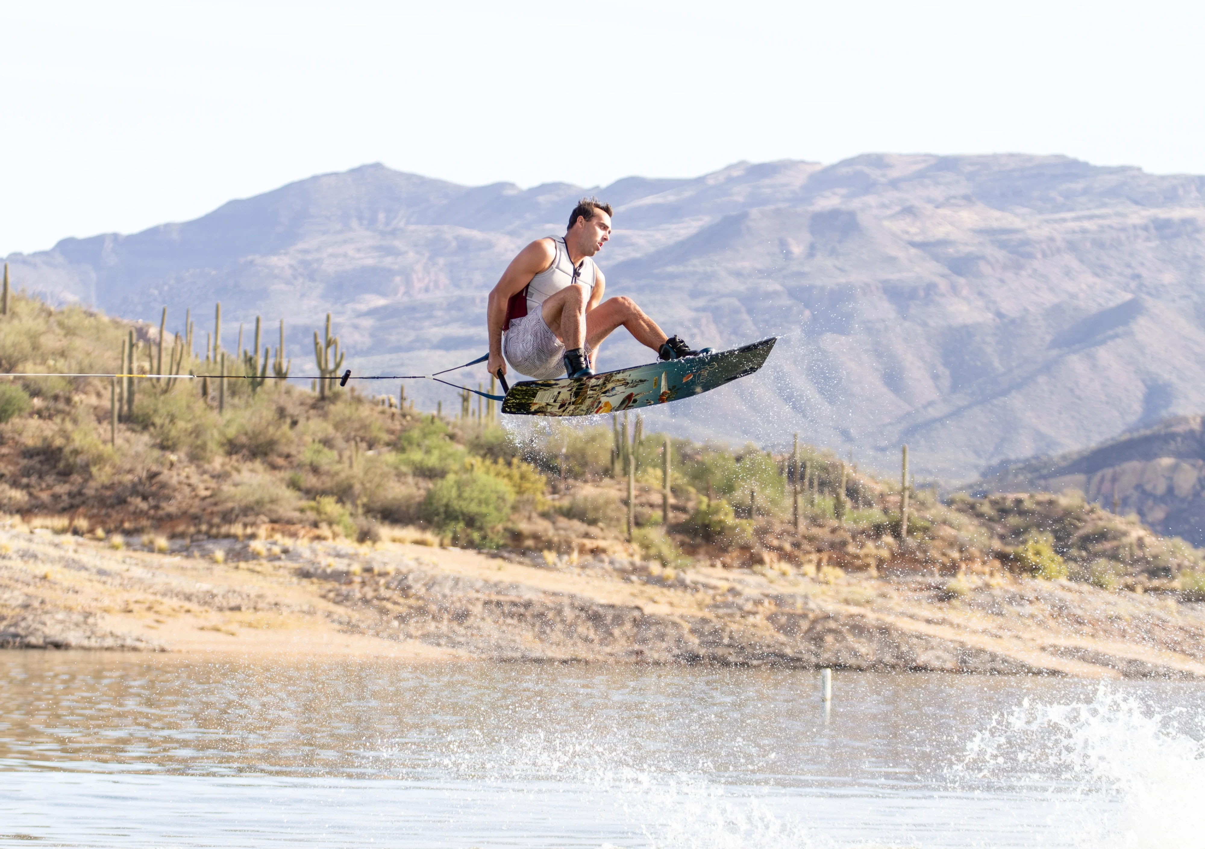 Action shot of Jake Pelot riding the Ronix Supreme wakeboard, shot in Arizona